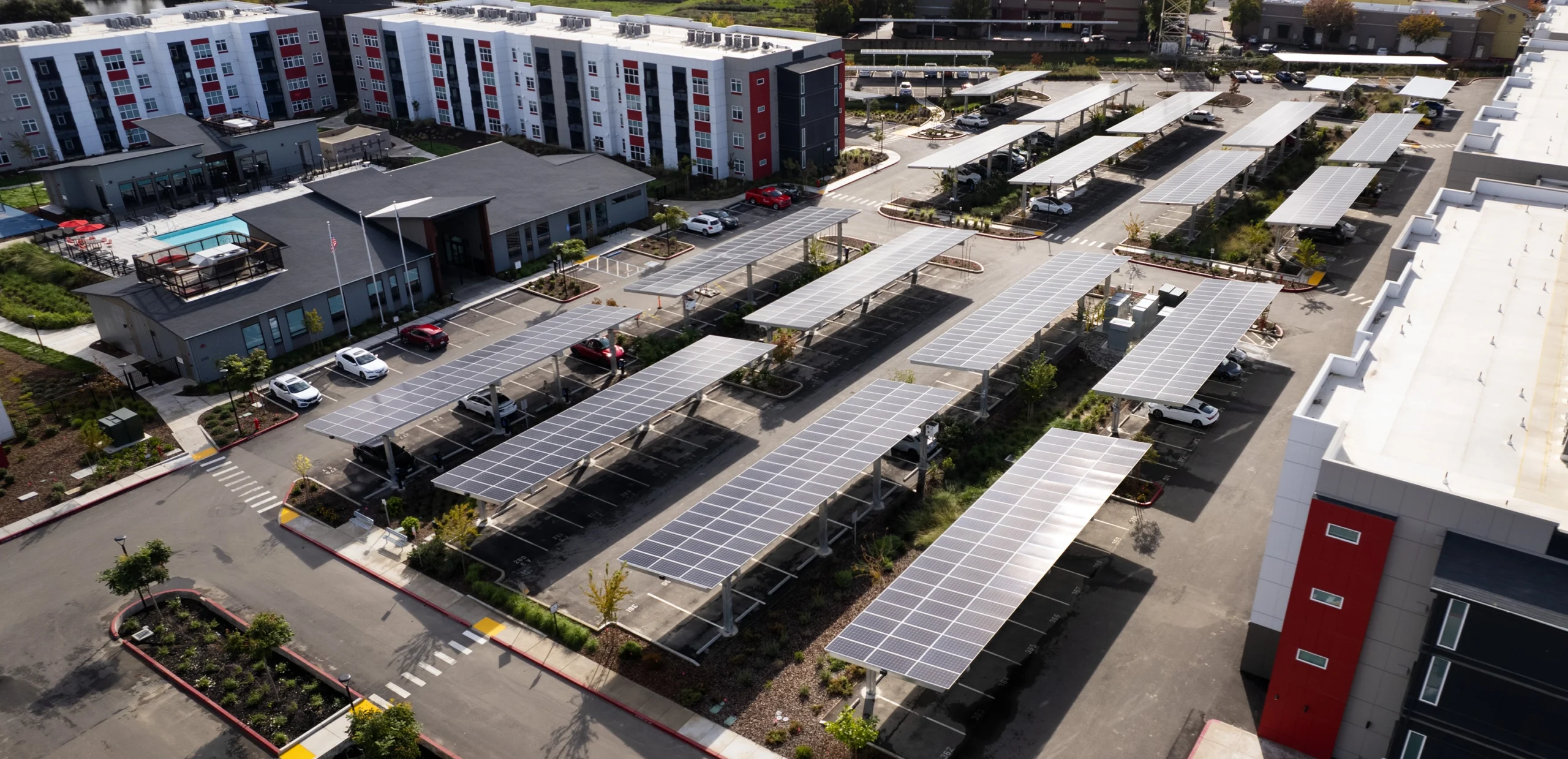 solar carports in parking lot of Kinect apartments