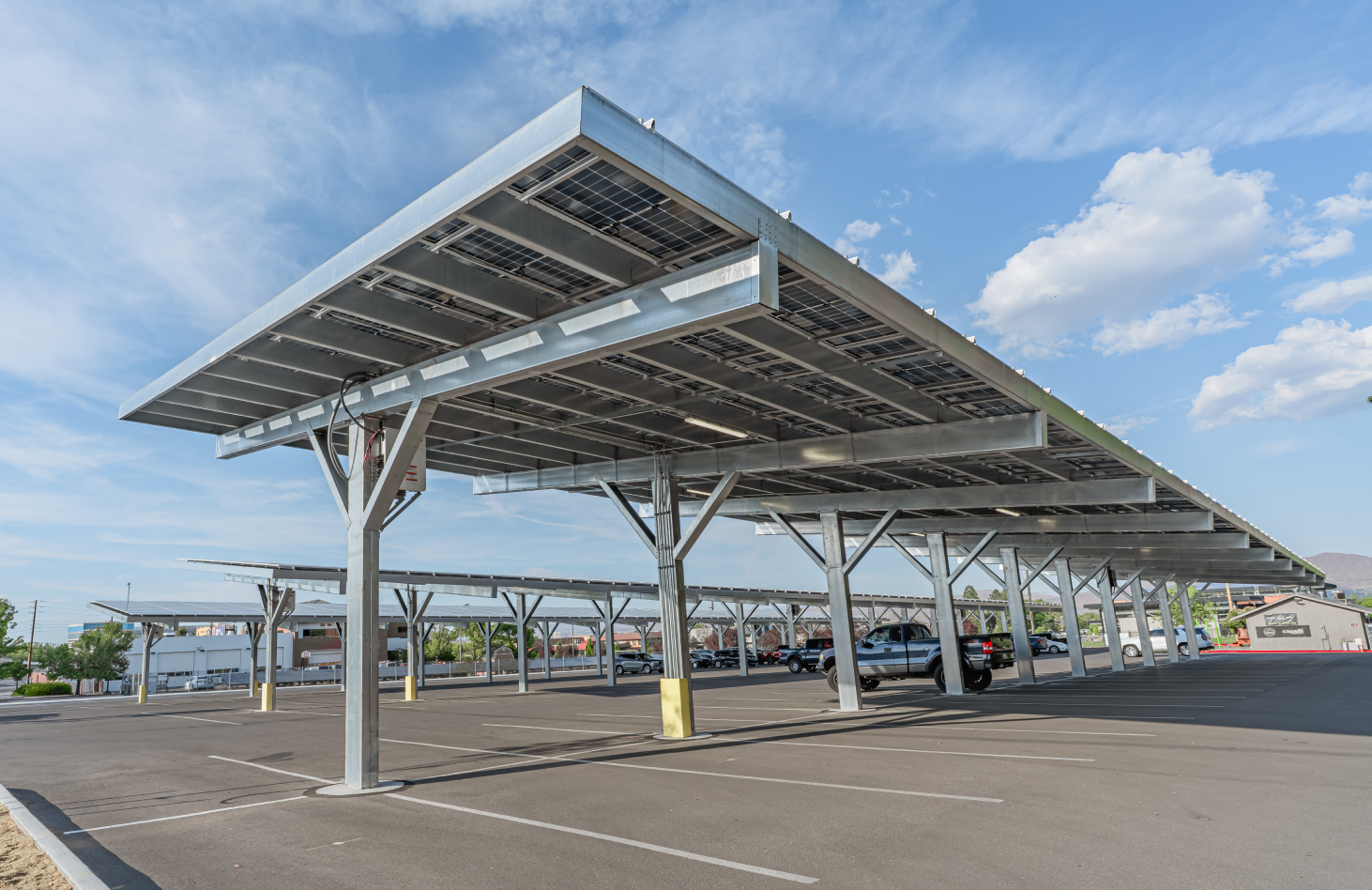 Solar carport structure in commercial parking lot