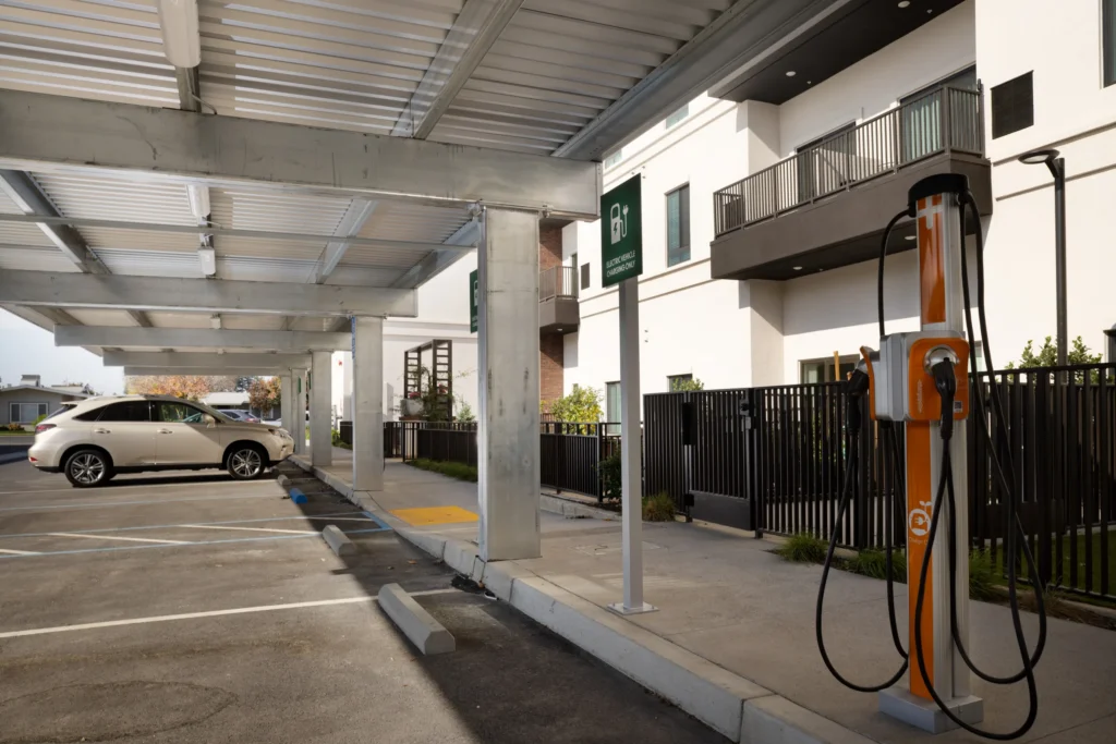 Shade carport structure in multifamily residential parking lot