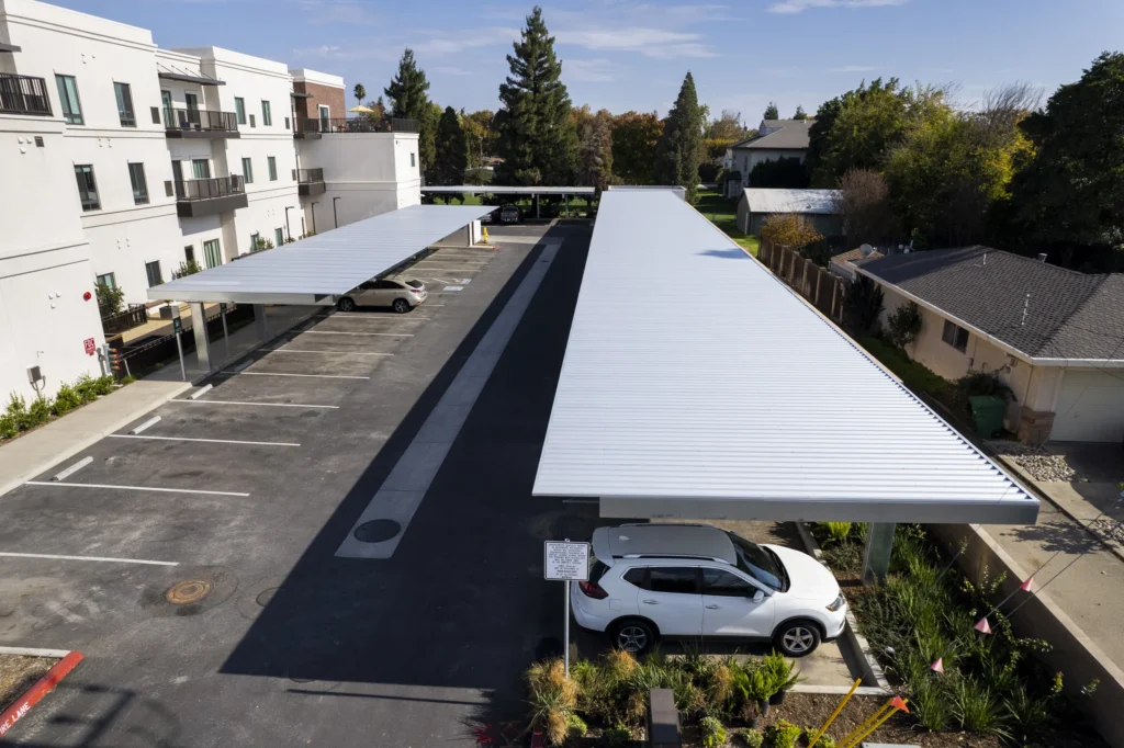 Shade carport structure in multifamily residential parking lot