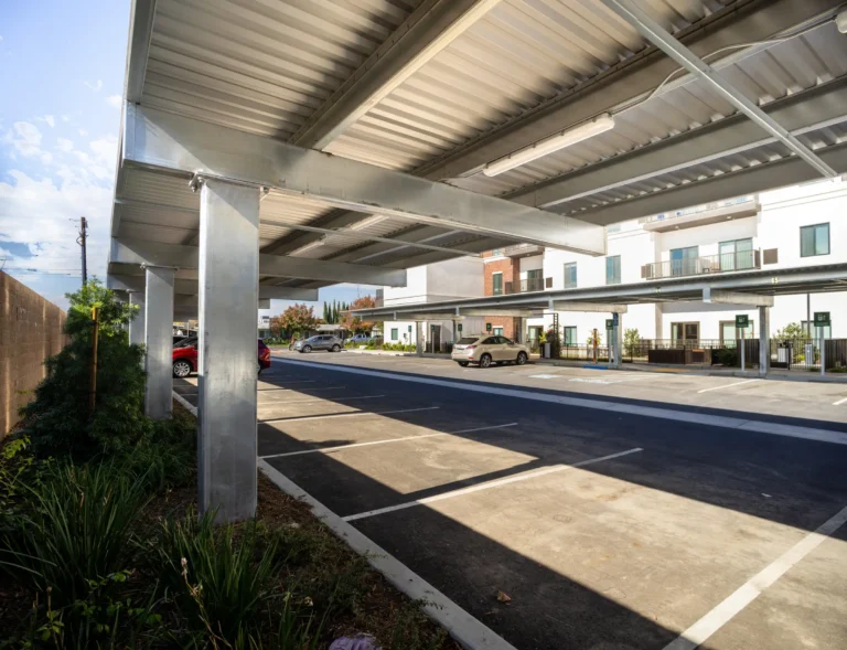 Shade carport structure in multifamily residential parking lot