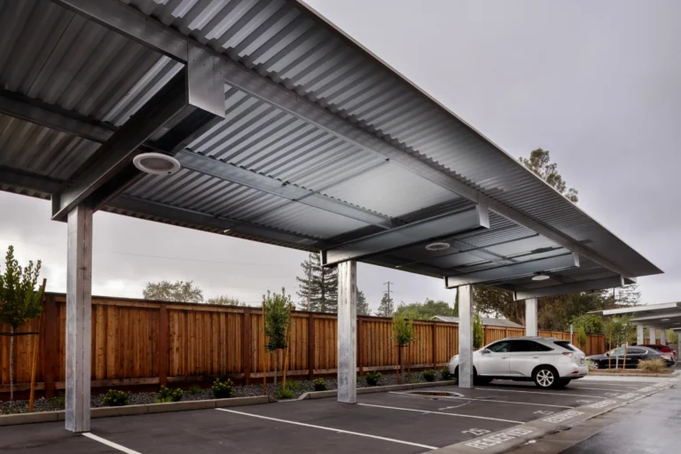 Shade carport structure in multifamily residential parking lot