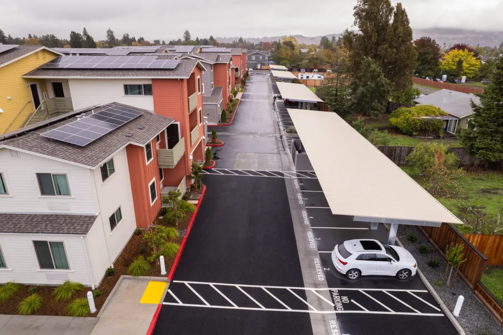 Shade carport structure in multifamily residential parking lot