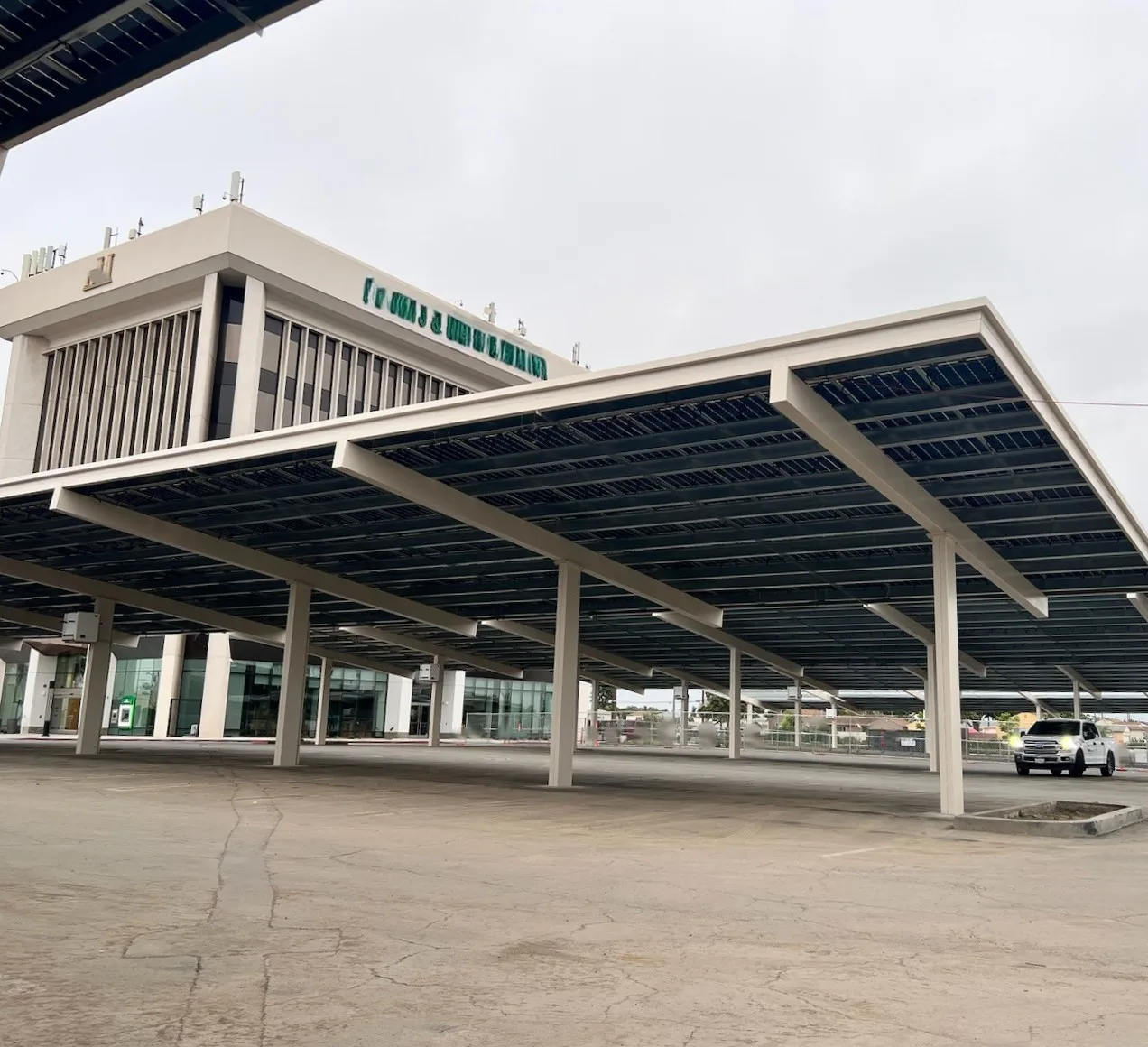 Solar carport box beam structure in bank parking lot