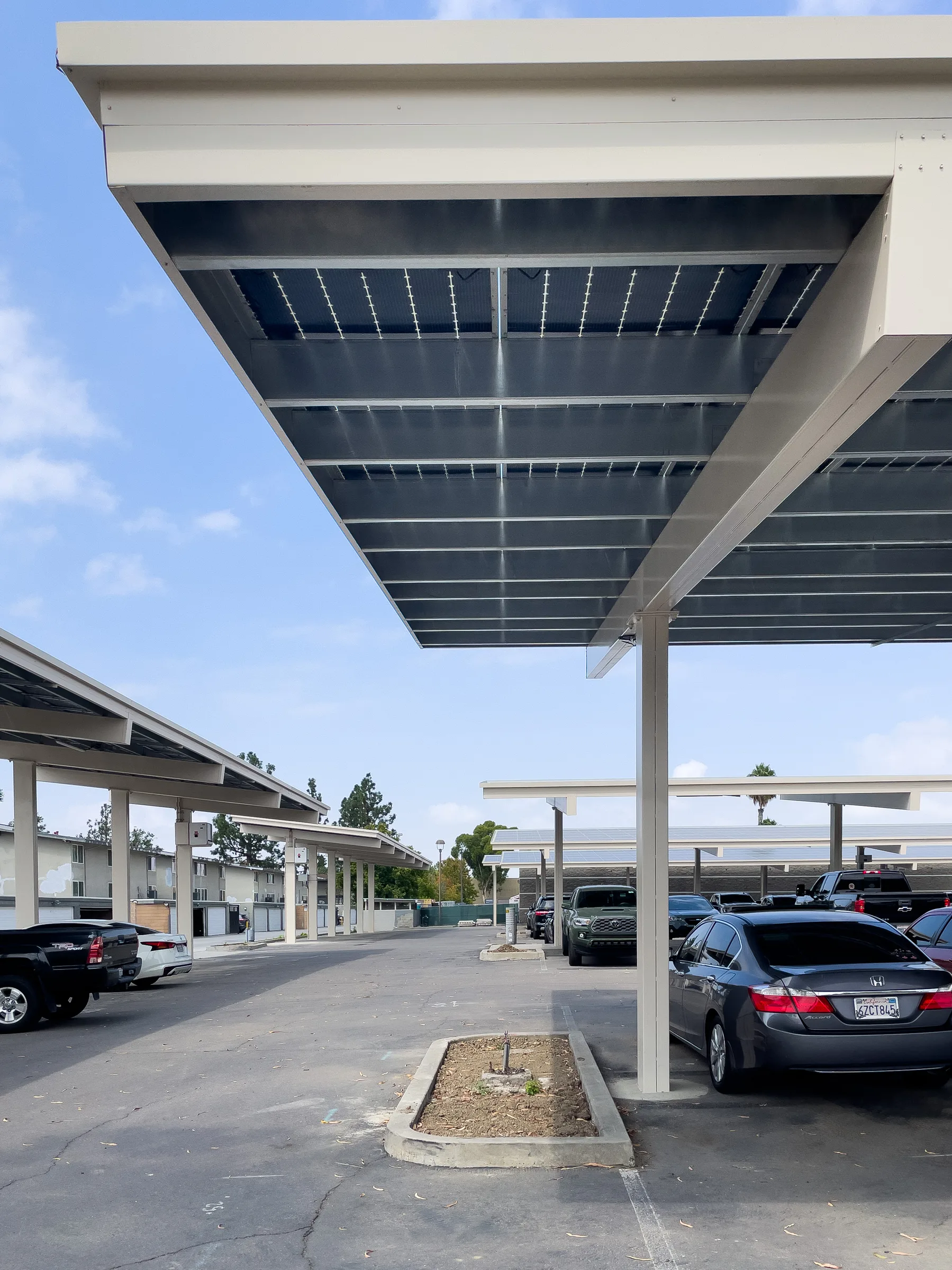 Solar carport box beam structure in bank parking lot