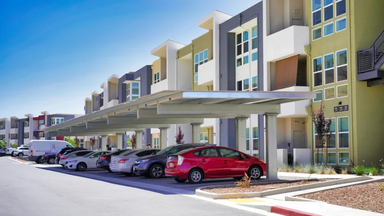 Shade carport structure in multifamily residential parking lot